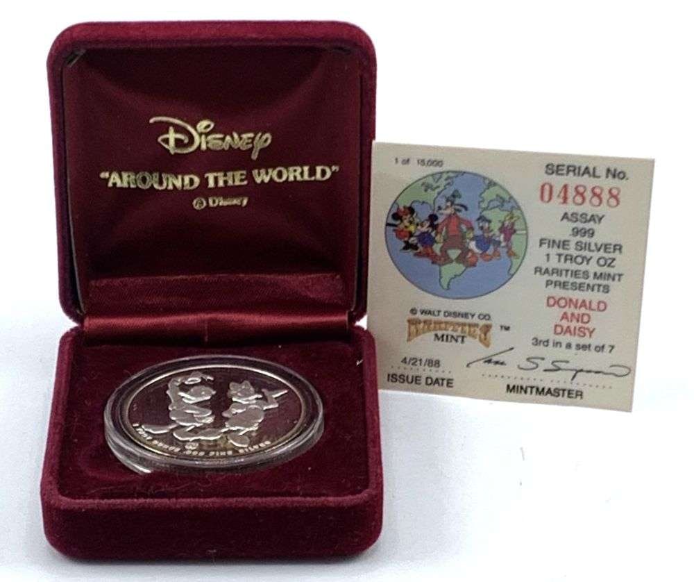 Disney "Around The World" Donald & Daisy Proof 1 ozt .999 Silver: Winner shall receive the exact coin shown here. (MR/UB)