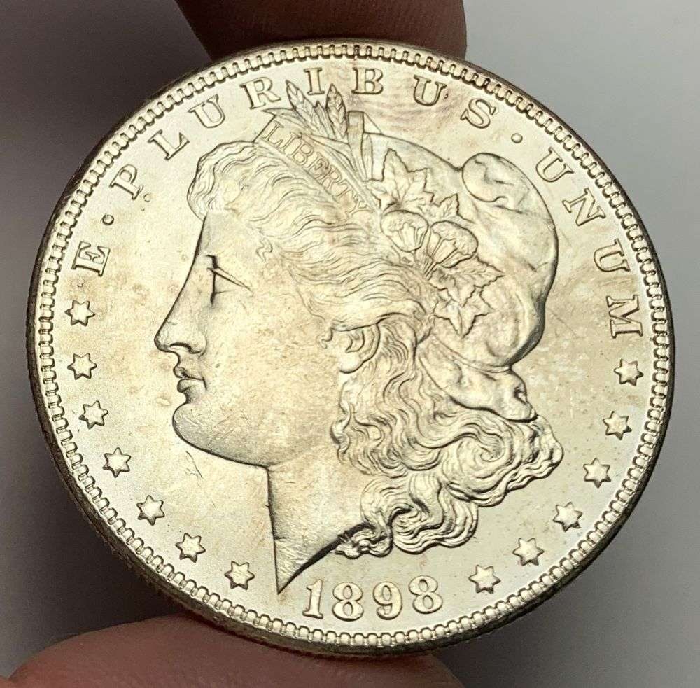 1898-O Morgan Silver Dollar MS63: A very special consignment. Once in a great while, some really, really nice silver dollars will hit the market. These coins come from a old, old-timer! By order of the consignor, none of these coins a