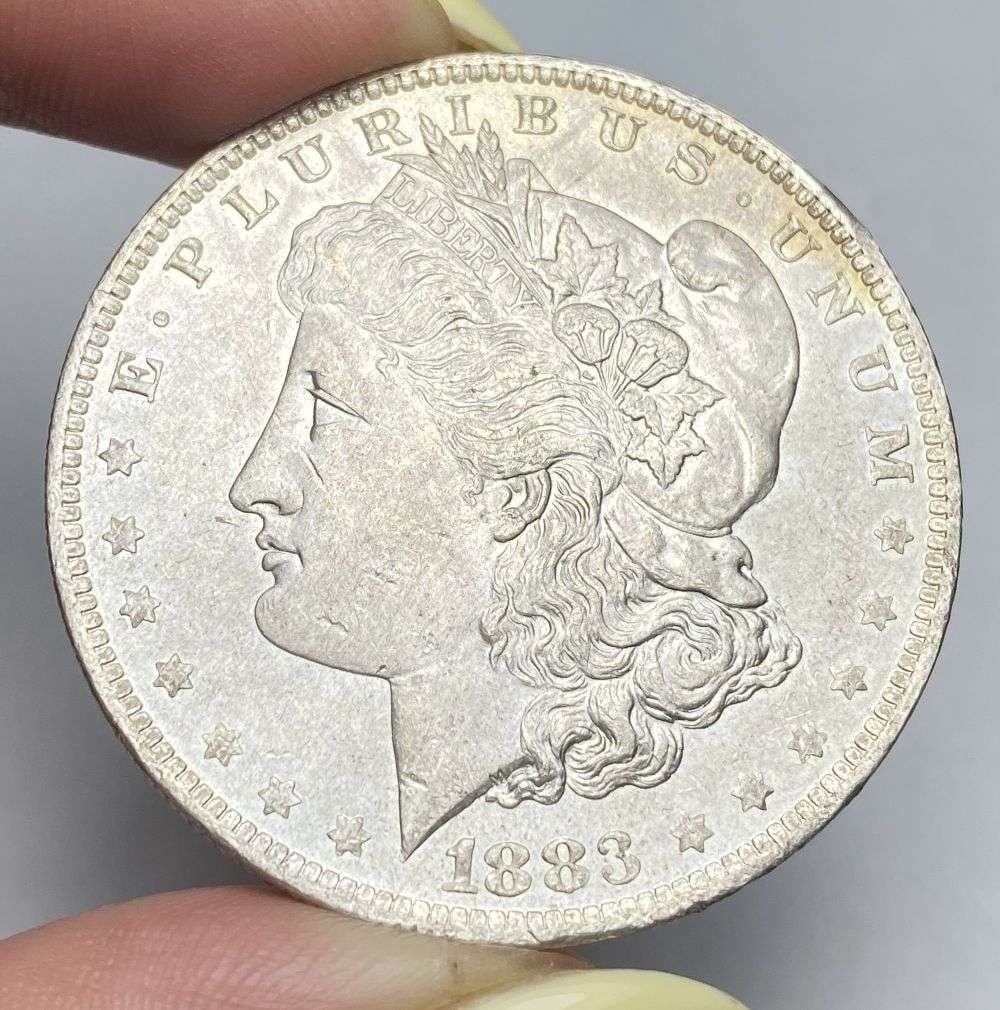 1883-O Morgan Silver Dollar MS64: Winner shall receive the exact coin shown here. (RR/PB)
