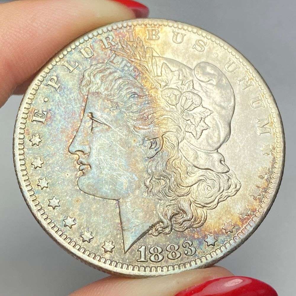 Toned 1883-O Morgan Silver Dollar MS65: This consignment, we hope to offer over time across our various Whatnot channels, with the best material featured in our Wednesday auctions. We hope to be done with this stuff by the beginning of 2027