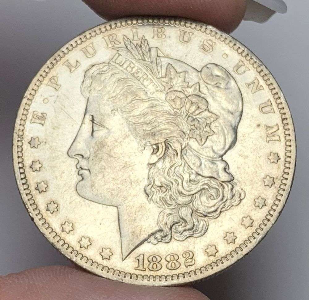 1882-O Morgan Silver Dollar AU58: This consignment, we hope to offer over time across our various Whatnot channels, with the best material featured in our Wednesday auctions. We hope to be done with this stuff by the beginning of 2027