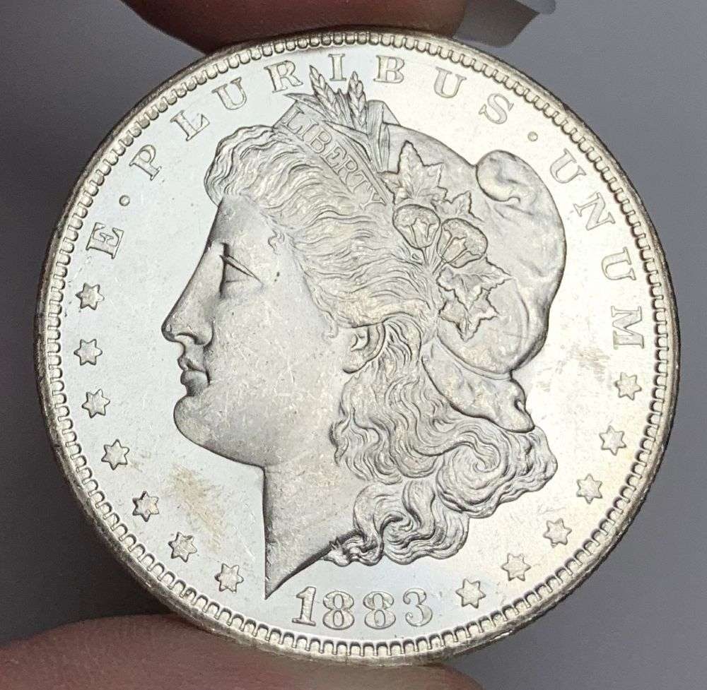 1883-CC Morgan Silver Dollar MS64: This consignment, we hope to offer over time across our various Whatnot channels, with the best material featured in our Wednesday auctions. We hope to be done with this stuff by the beginning of 2027