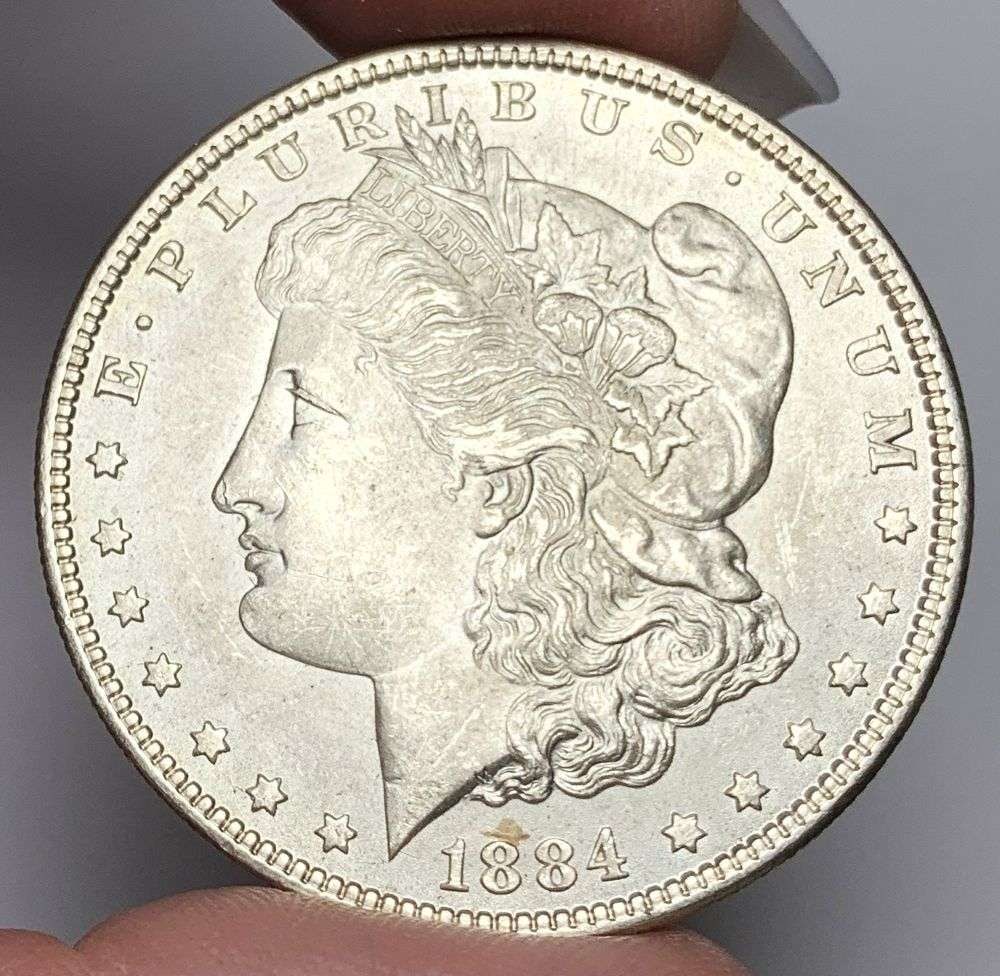 1884 Morgan Silver Dollar MS64: This consignment, we hope to offer over time across our various Whatnot channels, with the best material featured in our Wednesday auctions. We hope to be done with this stuff by the beginning of 2027