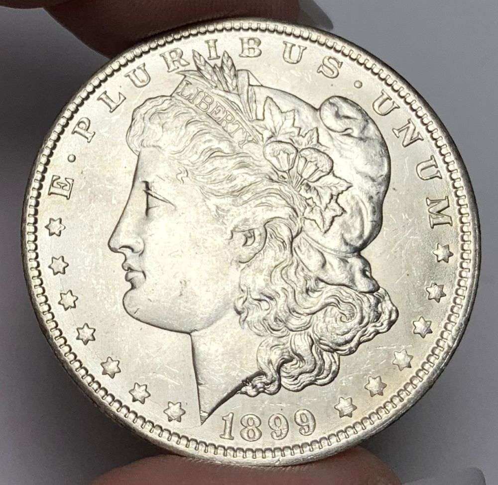 1899-O Morgan Silver Dollar MS64: This consignment, we hope to offer over time across our various Whatnot channels, with the best material featured in our Wednesday auctions. We hope to be done with this stuff by the beginning of 2027