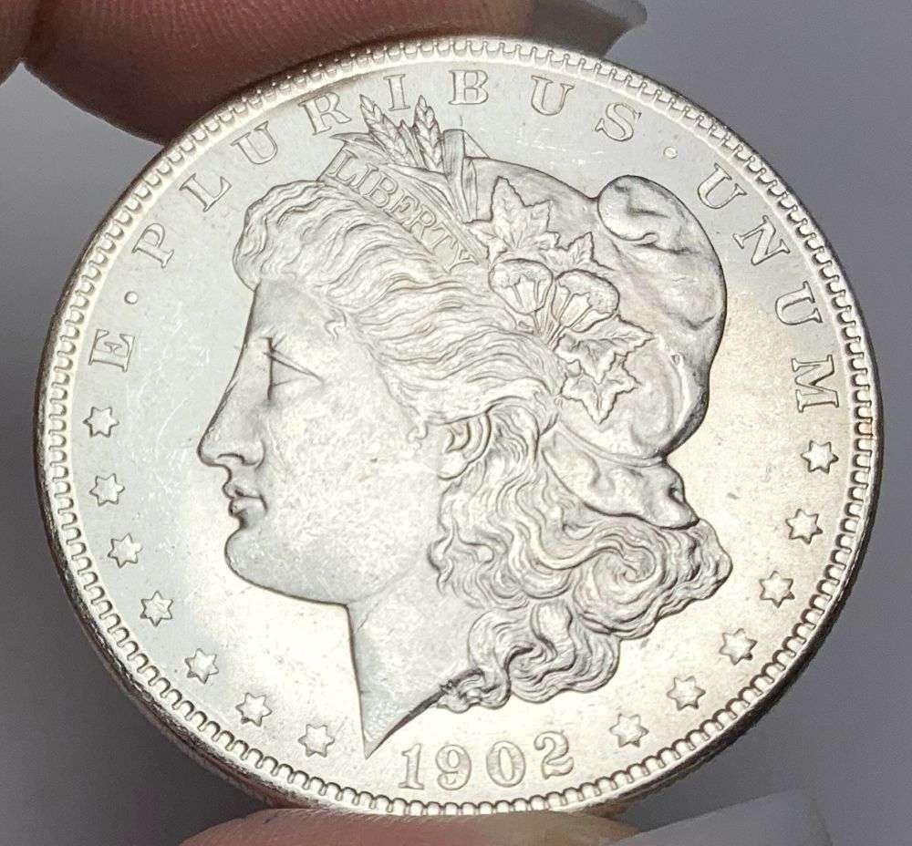 1902-O Morgan Silver Dollar MS64: This consignment, we hope to offer over time across our various Whatnot channels, with the best material featured in our Wednesday auctions. We hope to be done with this stuff by the beginning of 2027
