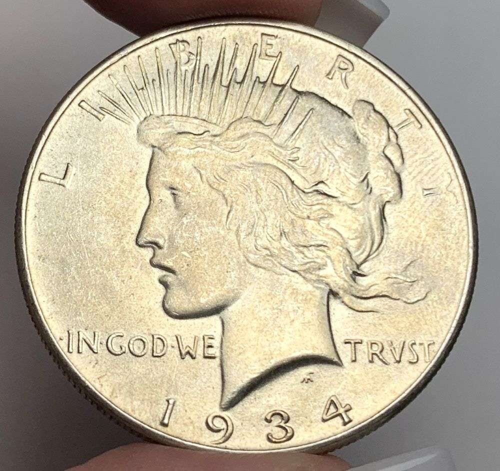 1934 Peace Silver Dollar MS64: A very special consignment. Once in a great while, some really, really nice silver dollars will hit the market. These coins come from a old, old-timer! By order of the consignor, none of these coins a