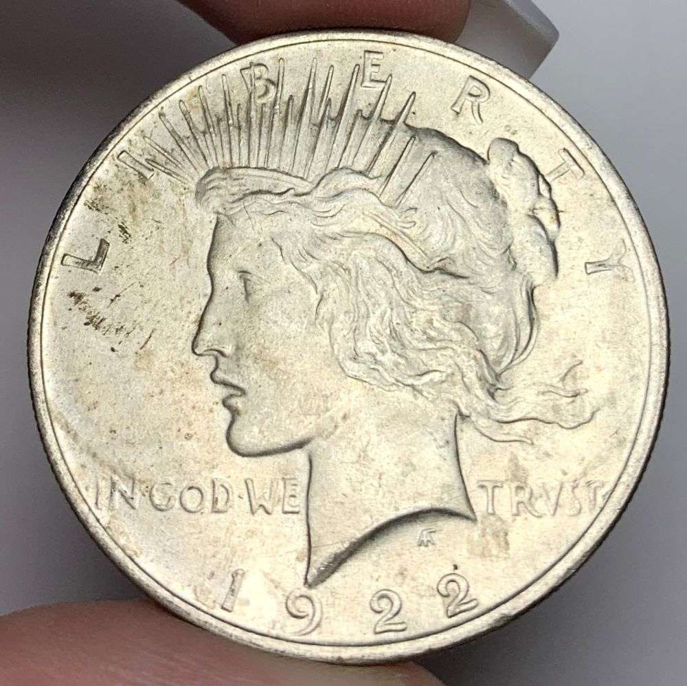 1922 Peace Silver Dollar MS65: A very special consignment. Once in a great while, some really, really nice silver dollars will hit the market. These coins come from a old, old-timer! By order of the consignor, none of these coins a