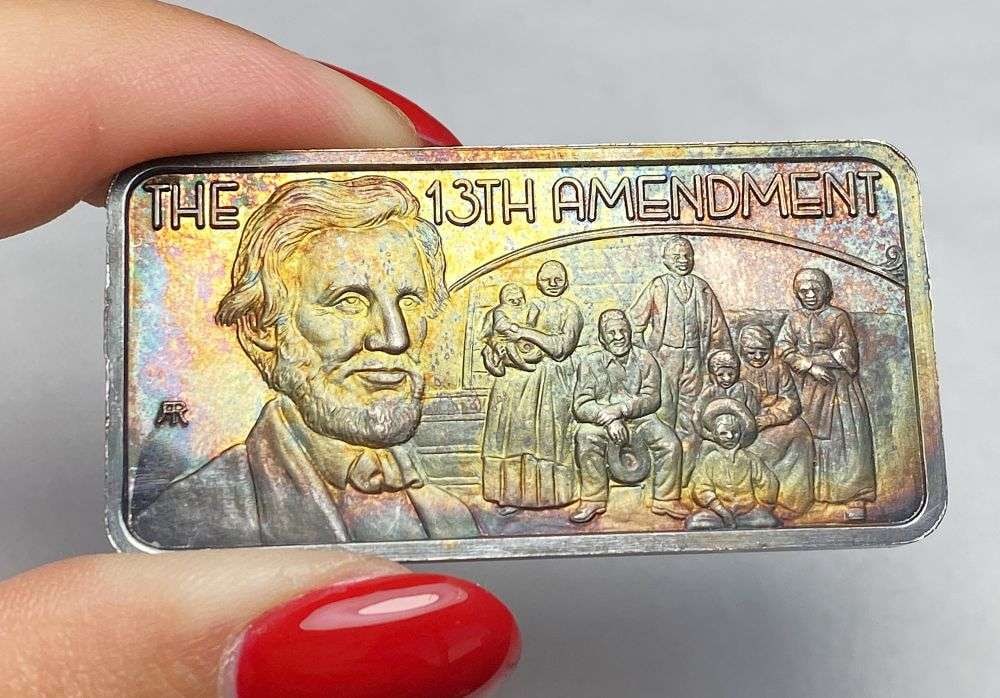 Toned America's Greatest Events "The 13th Amendment" 1 ozt .999 Silver Bar: Winner shall receive the exact bar shown here. (RR)