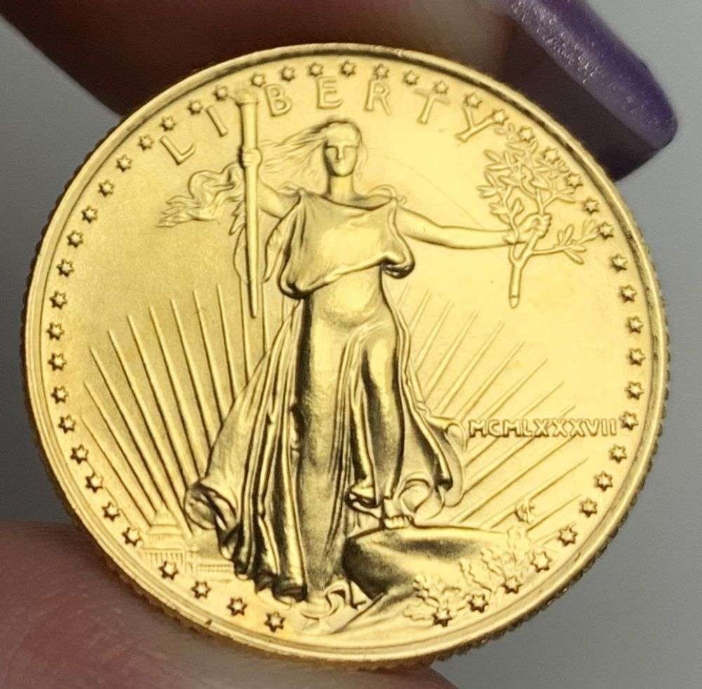 Last Minute Gold! Rare Roman Numeral 1987 American $10 Gold Eagle 1/4 ozt: We were recently visited by some old friends who were selling us a collection they had originally purchased from us, much of it decades ago. Winner shall receive the exact coin shown here. (MR/B)