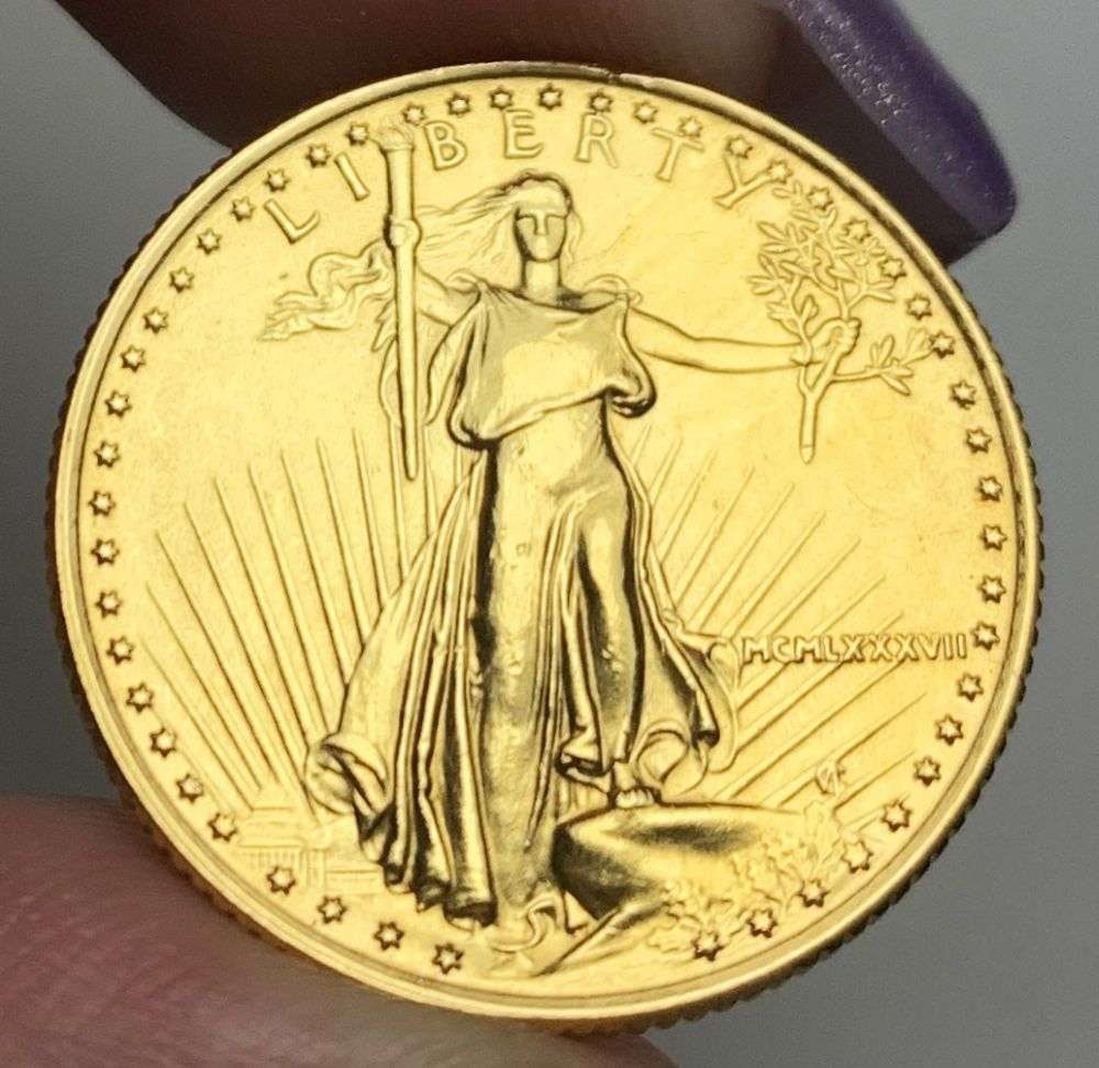 Last Minute Gold! Rare Roman Numeral 1987 American $10 Gold Eagle 1/4 ozt: We were recently visited by some old friends who were selling us a collection they had originally purchased from us, much of it decades ago. Winner shall receive the exact coin shown here. (MR/B)