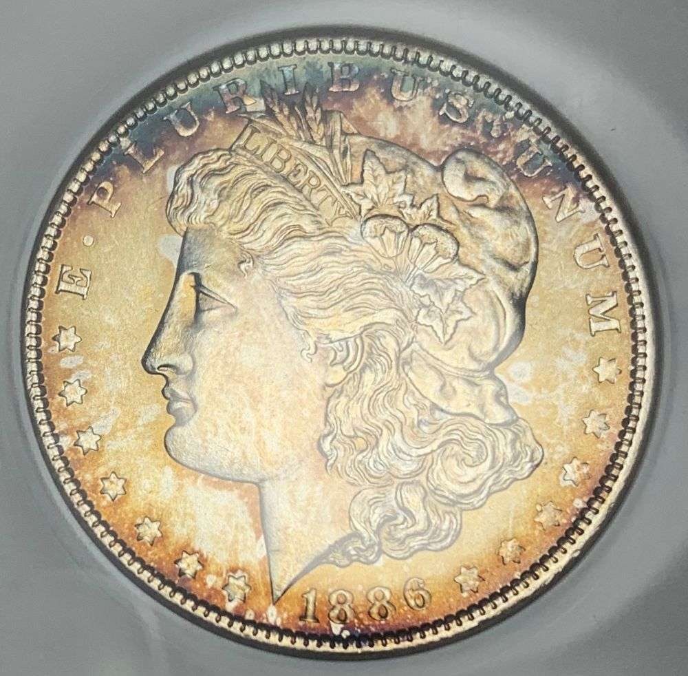 Last Minute! Old Soap Box Holder Toned 1886 Morgan Silver Dollar MS63: IMPORTANT NOTE: We do not agree with the grade provided with this "off-brand" grading company. Winner shall receive the exact coin shown here. (MR/FR)