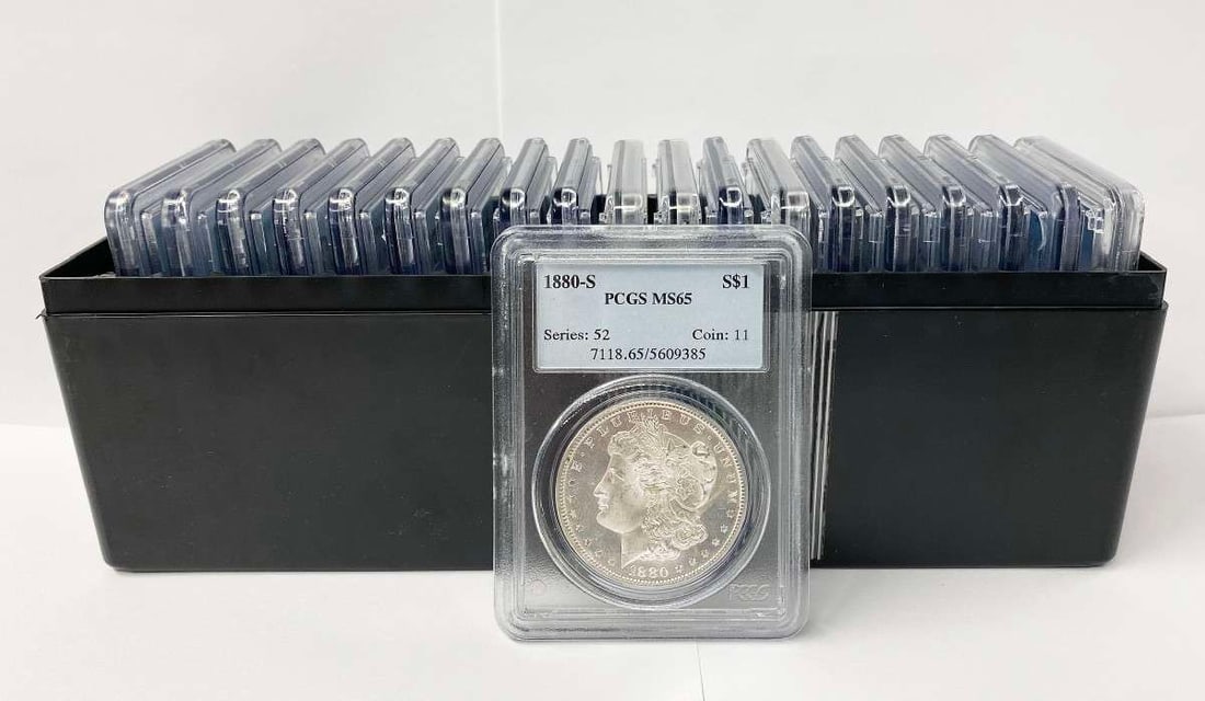 (20) Mixed Date & MM PCGS MS65 Morgan Silver Dollars: This item comes from our consignors vault in Chicago. Please allow 2-4 weeks for delivery. Winner of this lot shall receive (20) Morgan Silver Dollars in PCGS MS65, precisely resembling the coins show