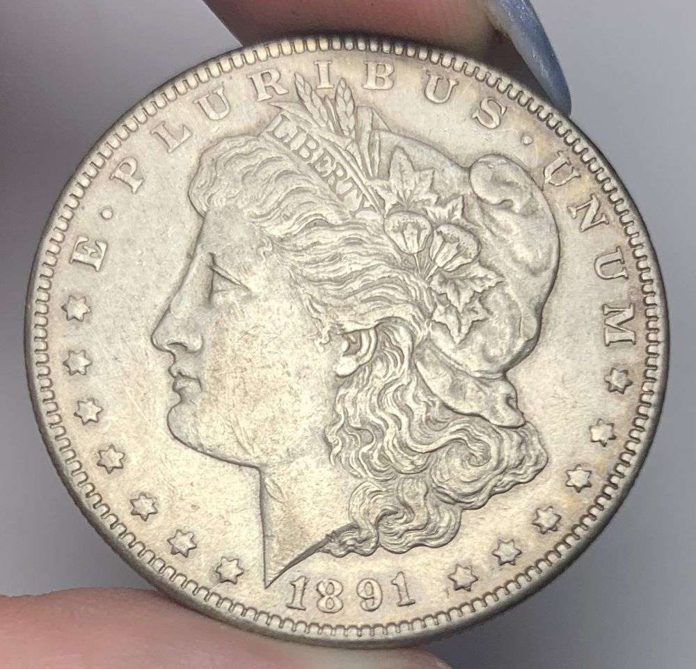 1891-CC Morgan Silver Dollar AU55: This consignment, we hope to offer over time across our various Whatnot channels, with the best material featured in our Wednesday auctions. We hope to be done with this stuff by the beginning of 2027