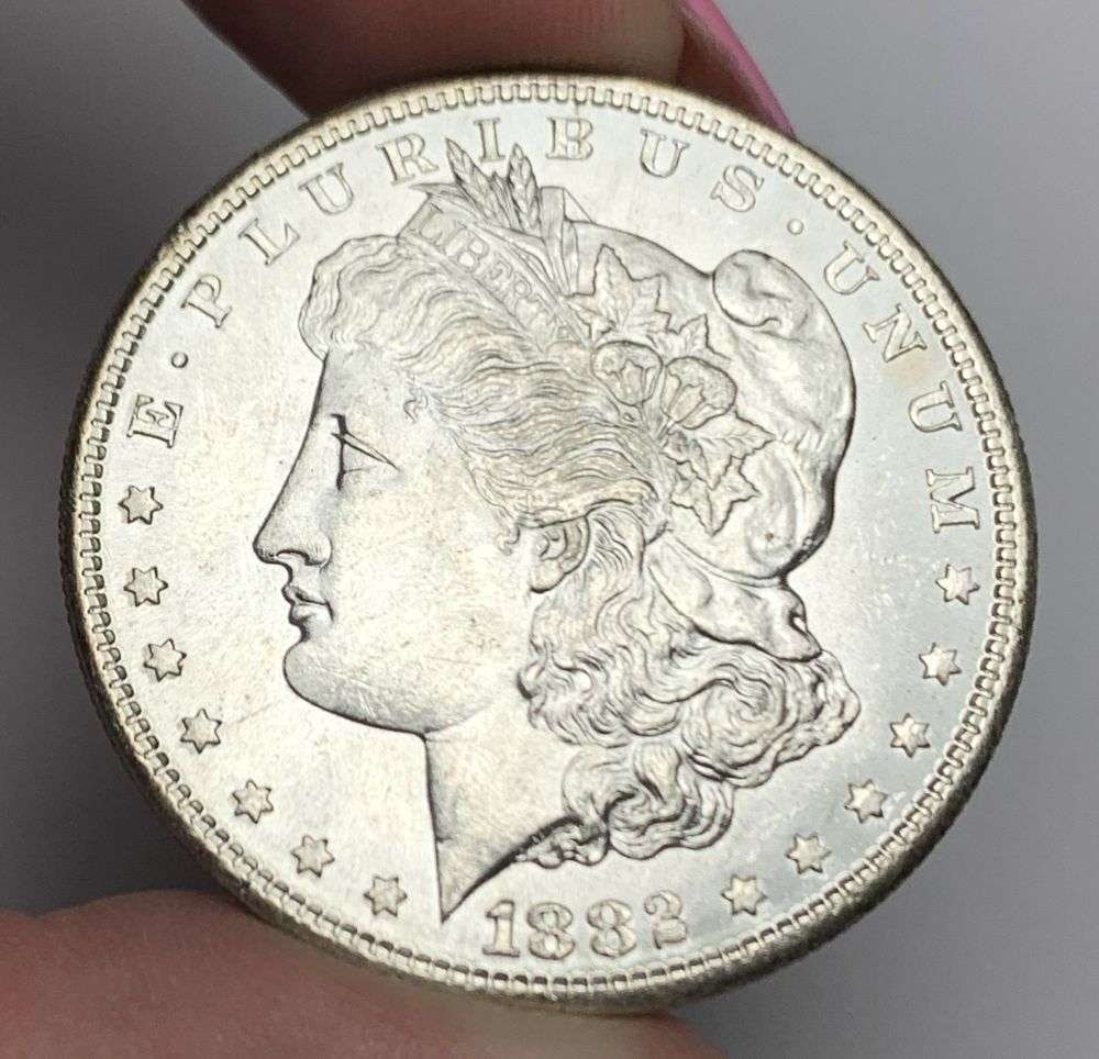 1882-S Morgan Silver Dollar MS63: This is (1) coin from a book that we received along with the heavy black book of silver dollars. Winner shall receive the exact coin shown here. (MR/EB)