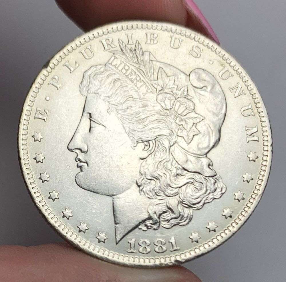 1881-O Morgan Silver Dollar MS64 Details: This is (1) coin from a book that we received along with the heavy black book of silver dollars. Winner shall receive the exact coin shown here. (MR/EB)