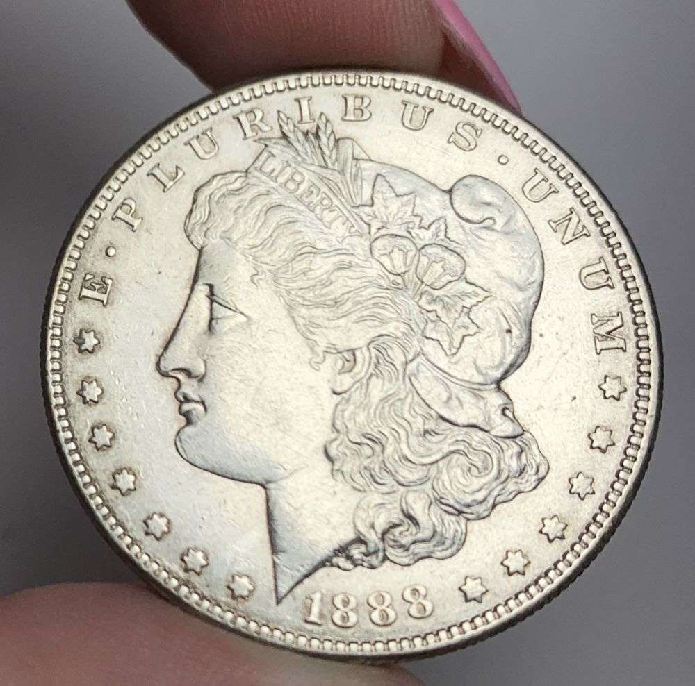 1888-S Morgan Silver Dollar AU Details: This is (1) coin from a book that we received along with the heavy black book of silver dollars. Winner shall receive the exact coin shown here. (MR/RB)