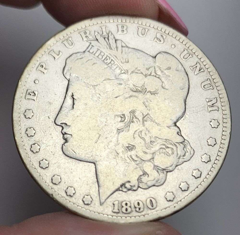 1890-CC Morgan Silver Dollar VG: This is (1) coin from a book that we received along with the heavy black book of silver dollars. Winner shall receive the exact coin shown here. (MR/LBB)