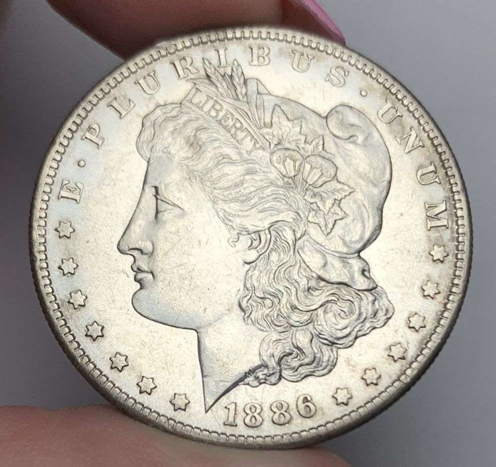 1886-S Morgan Silver Dollar MS63 Details: This is (1) coin from a book that we received along with the heavy black book of silver dollars. Winner shall receive the exact coin shown here. (MR/EB)