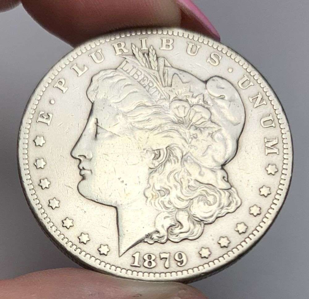 1879-CC Morgan Silver Dollar VF Details: This is (1) coin from a book that we received along with the heavy black book of silver dollars. Winner shall receive the exact coin shown here. (MR/LBB)