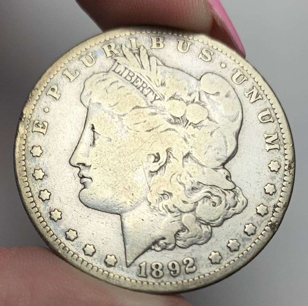 1892-S Morgan Silver Dollar Fine: This is (1) coin from a book that we received along with the heavy black book of silver dollars. Winner shall receive the exact coin shown here. (MR/PB)