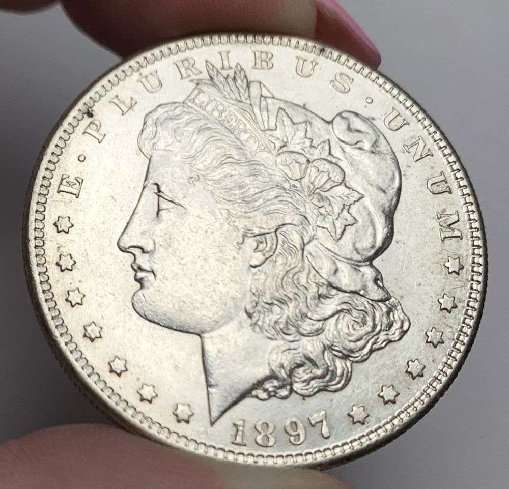 1897-S Morgan Silver Dollar MS63 Details: This is (1) coin from a book that we received along with the heavy black book of silver dollars. Winner shall receive the exact coin shown here. (MR/PB)