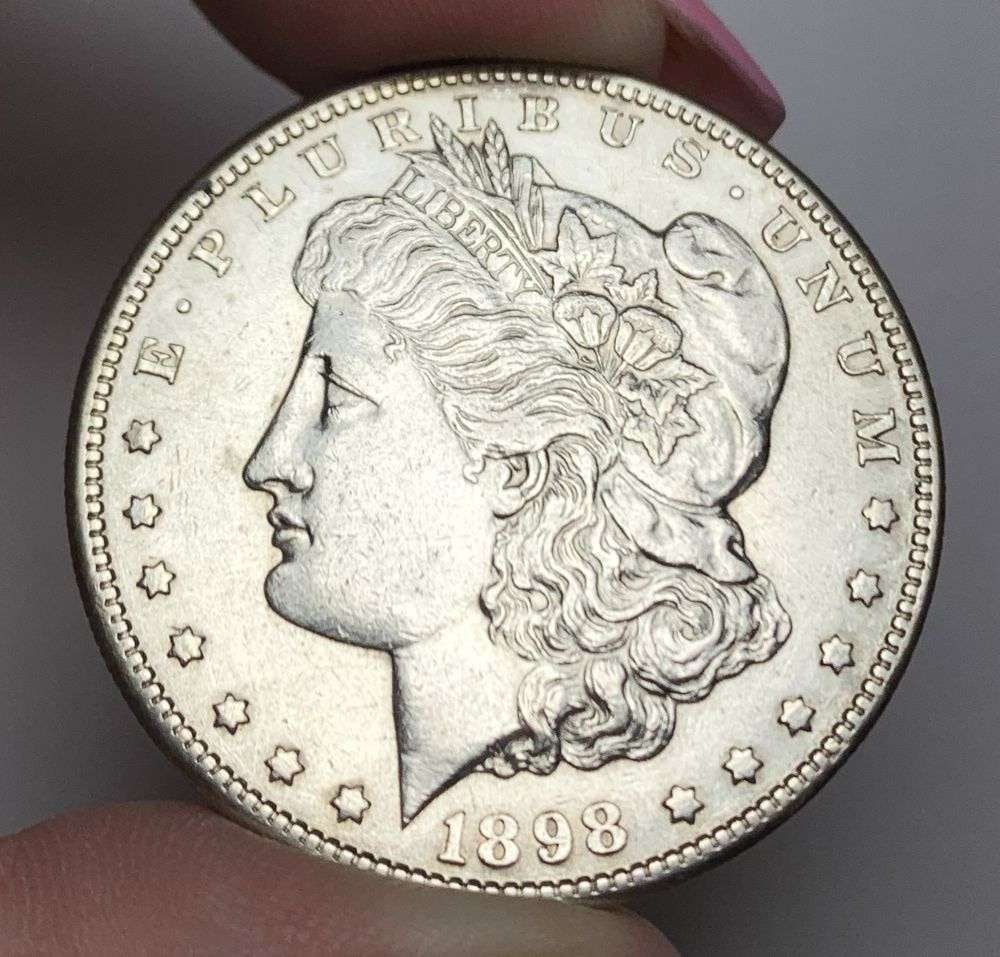 1898-S Morgan Silver Dollar AU55 Details: This is (1) coin from a book that we received along with the heavy black book of silver dollars. Winner shall receive the exact coin shown here. (MR/PB)