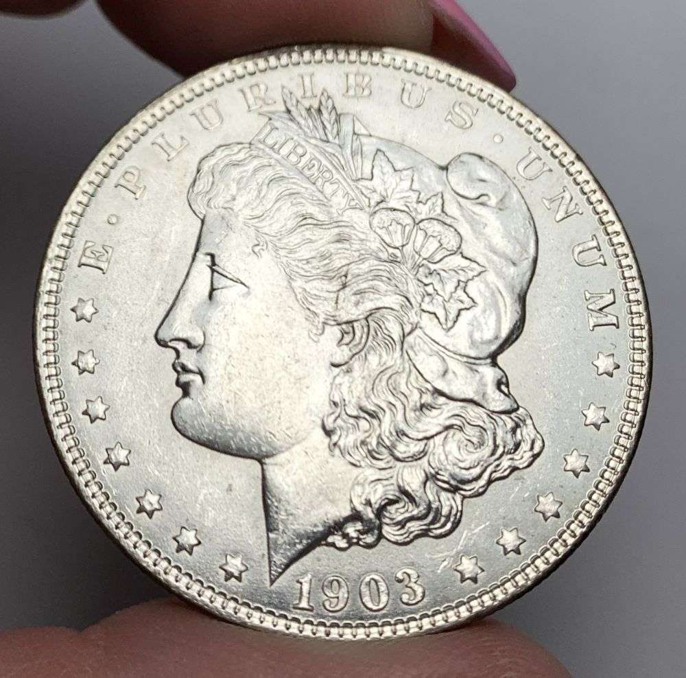 1903-O Morgan Silver Dollar MS64: This is (1) coin from a book that we received along with the heavy black book of silver dollars. Winner shall receive the exact coin shown here. (MR/PB)