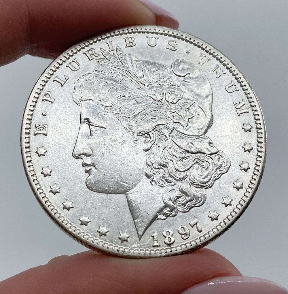 1897-O Morgan Silver Dollar MS62 Details: This is (1) coin from a book that we received along with the heavy black book of silver dollars. Winner shall receive the exact coin shown here. (MR/PB)