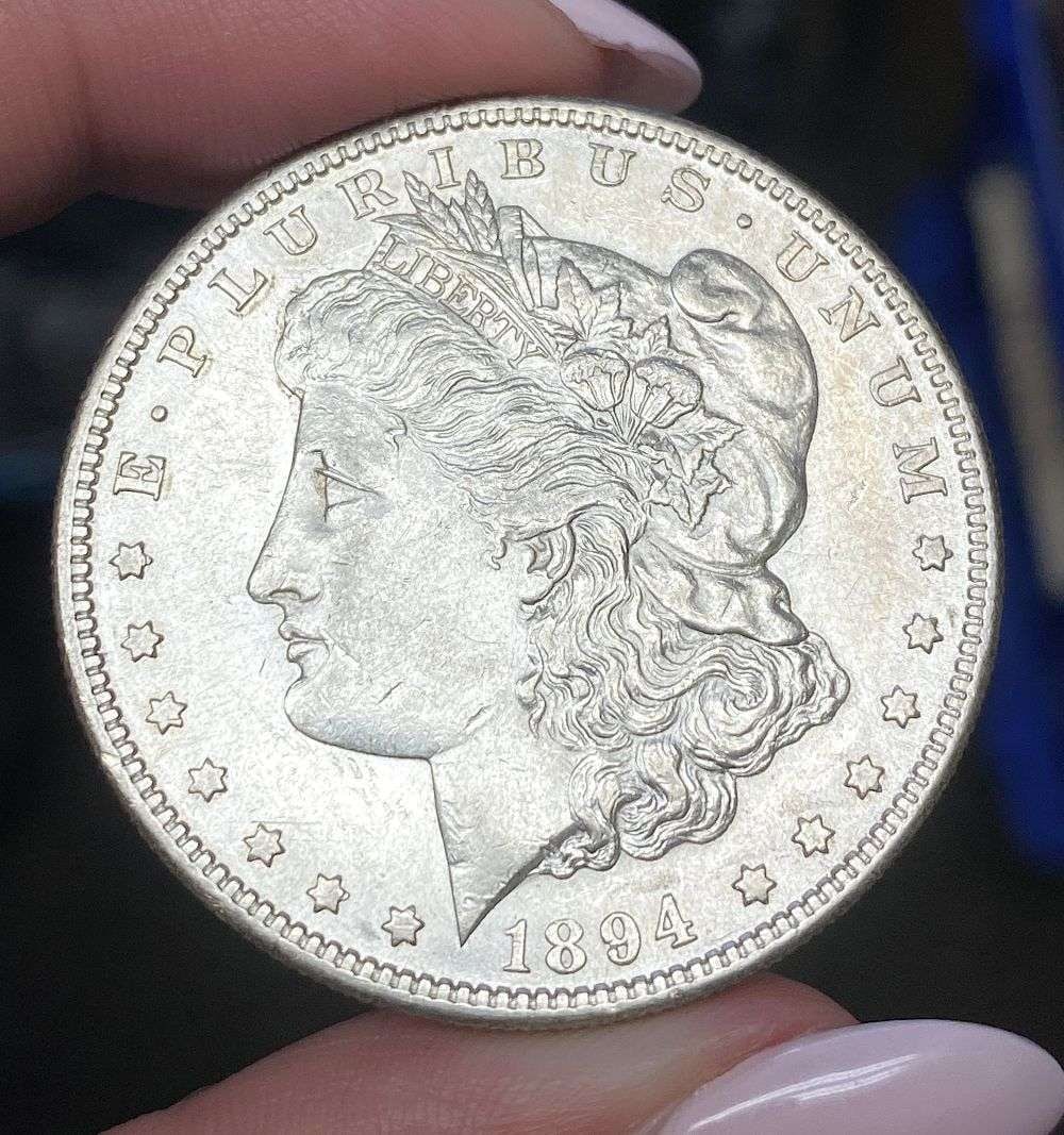 1894-S Morgan Silver Dollar MS62 Details: This is (1) coin from a book that we received along with the heavy black book of silver dollars. Winner shall receive the exact coin shown here. (MR/PB)