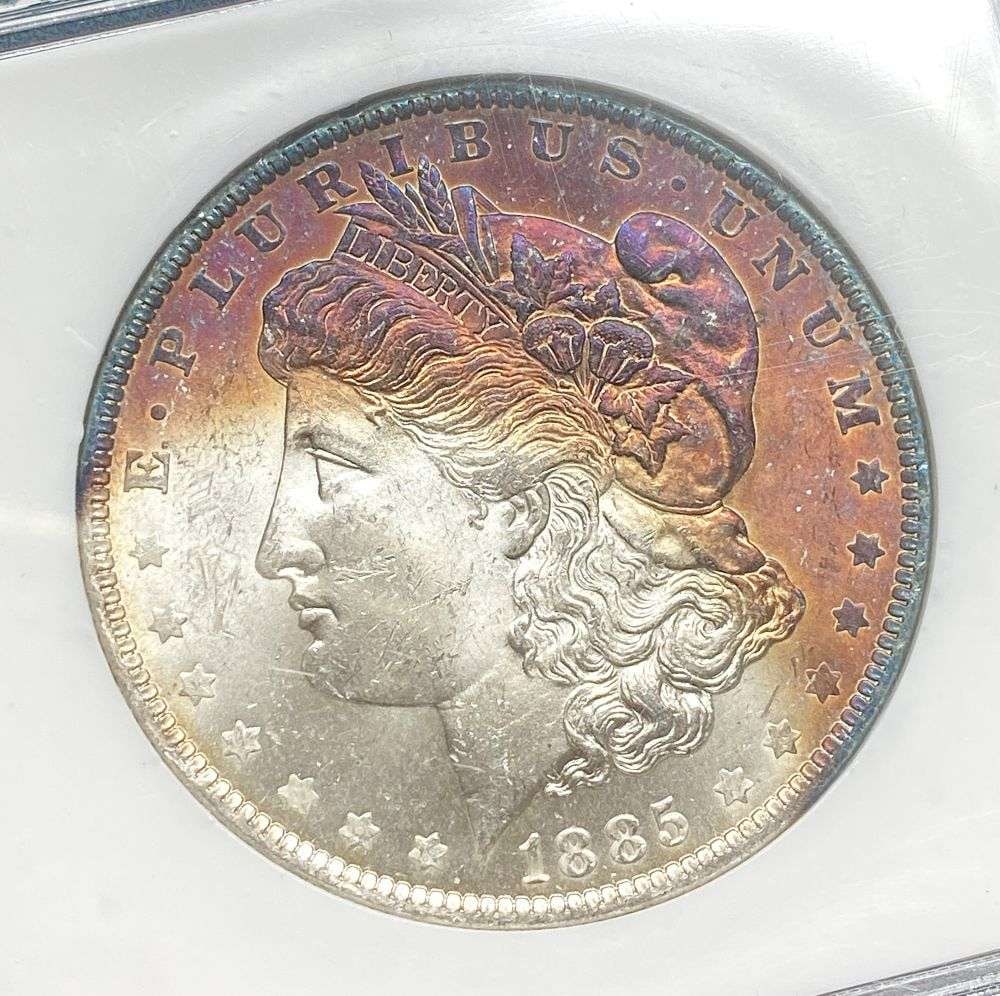 Toned 1885-O Morgan Silver Dollar MS65: IMPORTANT NOTE: We do not agree with the grade provided with this "off-brand" grading company. Winner shall receive the exact coin shown here. (RR)
