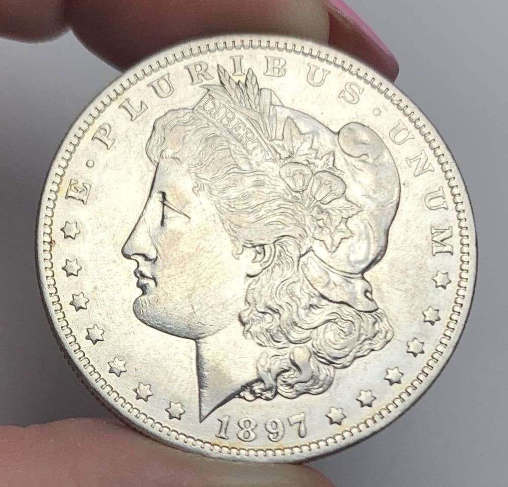 1897-O Morgan Silver Dollar AU53: This consignment, we hope to offer over time across our various Whatnot channels, with the best material featured in our Wednesday auctions. We hope to be done with this stuff by the beginning of 2027