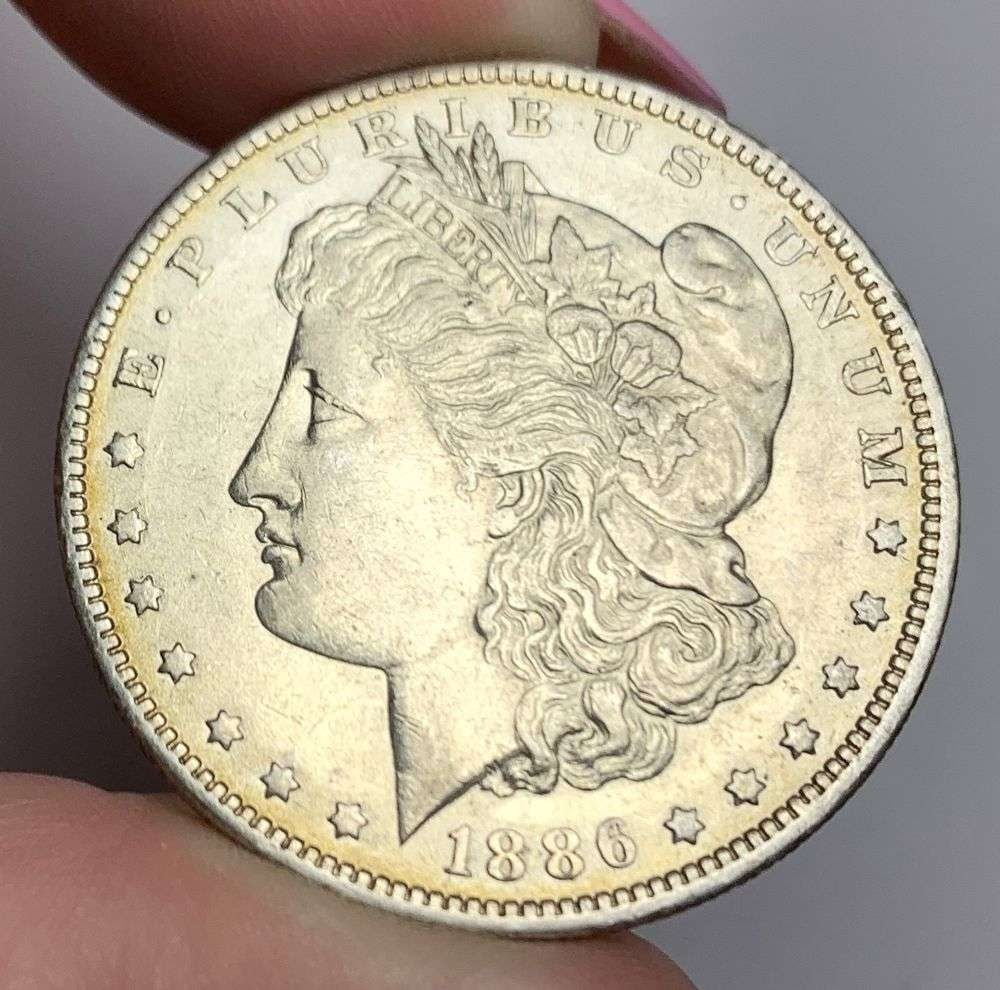 1886-O Morgan Silver Dollar AU58: This consignment, we hope to offer over time across our various Whatnot channels, with the best material featured in our Wednesday auctions. We hope to be done with this stuff by the beginning of 2027