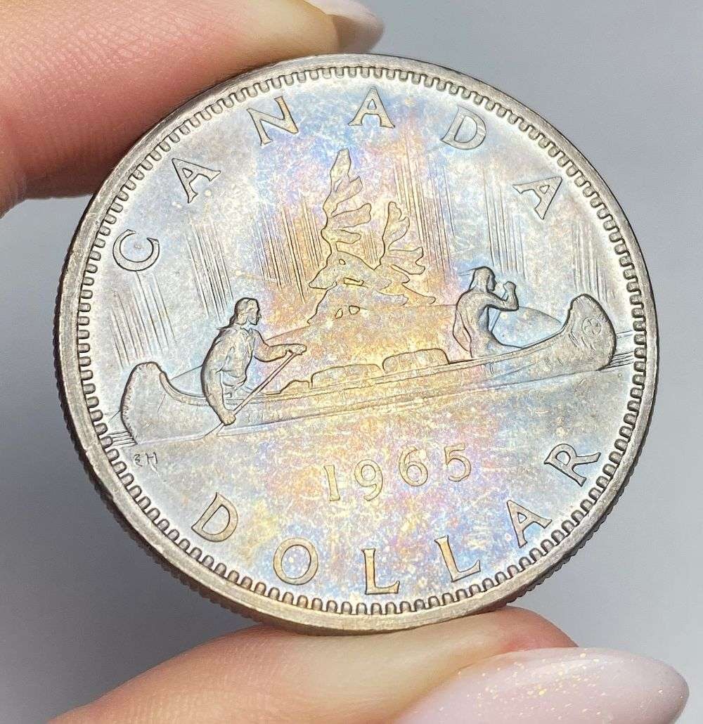 Toned 1965 Canada Silver Dollar: Winner shall receive the exact coin shown here. (RR)