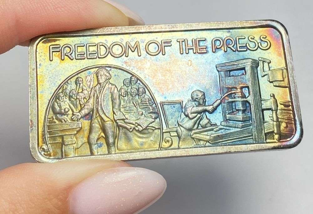 Toned America's Greatest Events "Freedom of the Press" 1 ozt .999 Silver Bar: Winner shall receive the exact bar shown here. (RR)