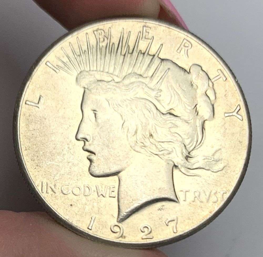 1927 Peace Silver Dollar AU58: This consignment, we hope to offer over time across our various Whatnot channels, with the best material featured in our Wednesday auctions. We hope to be done with this stuff by the beginning of 2027