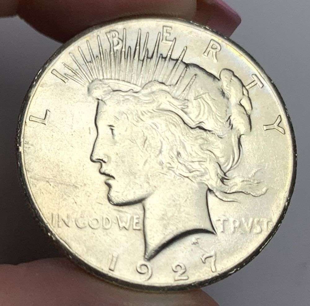 1927 Peace Silver Dollar AU58: This consignment, we hope to offer over time across our various Whatnot channels, with the best material featured in our Wednesday auctions. We hope to be done with this stuff by the beginning of 2027