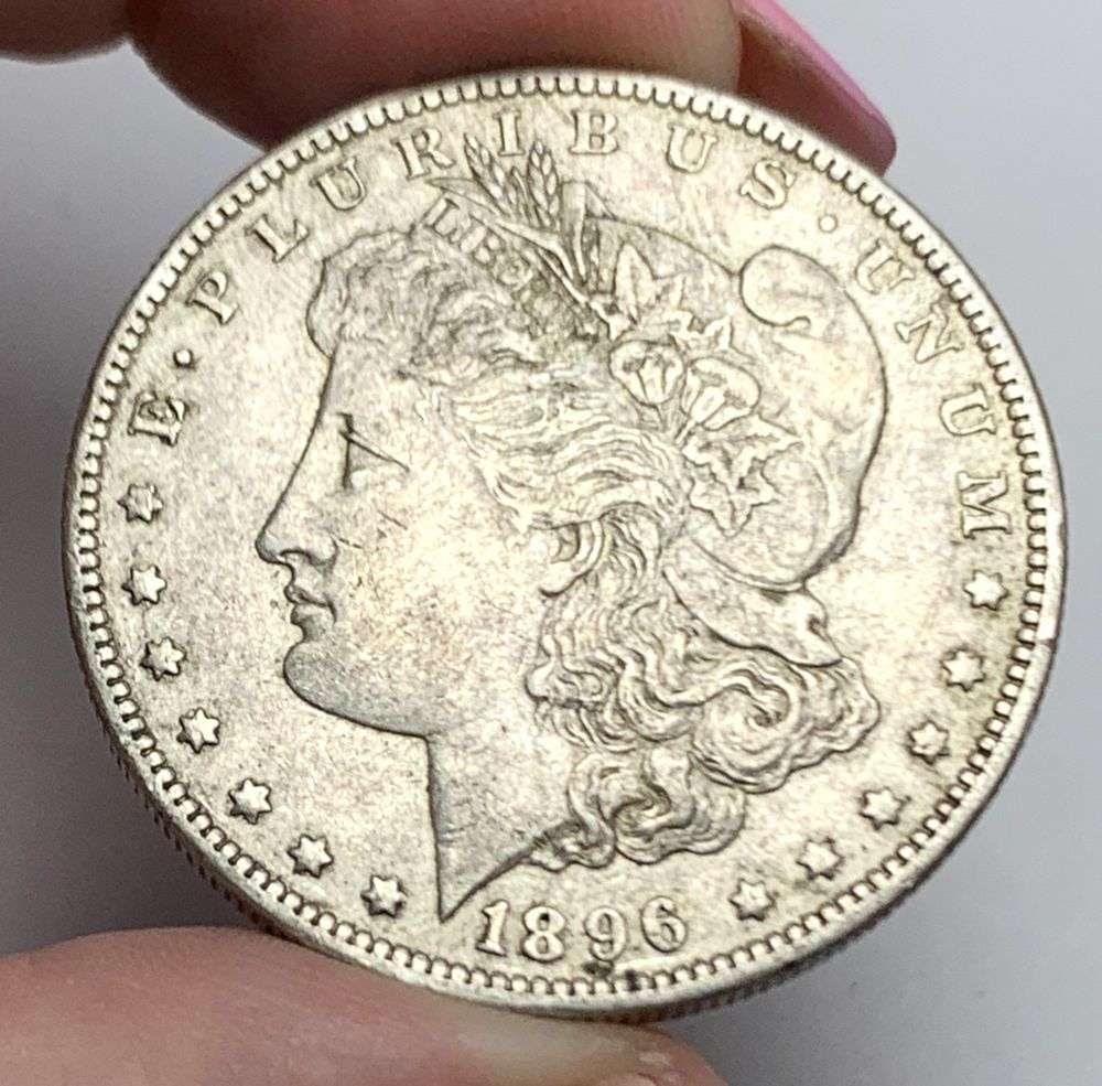 1896-O Morgan Silver Dollar AU58: This consignment, we hope to offer over time across our various Whatnot channels, with the best material featured in our Wednesday auctions. We hope to be done with this stuff by the beginning of 2027