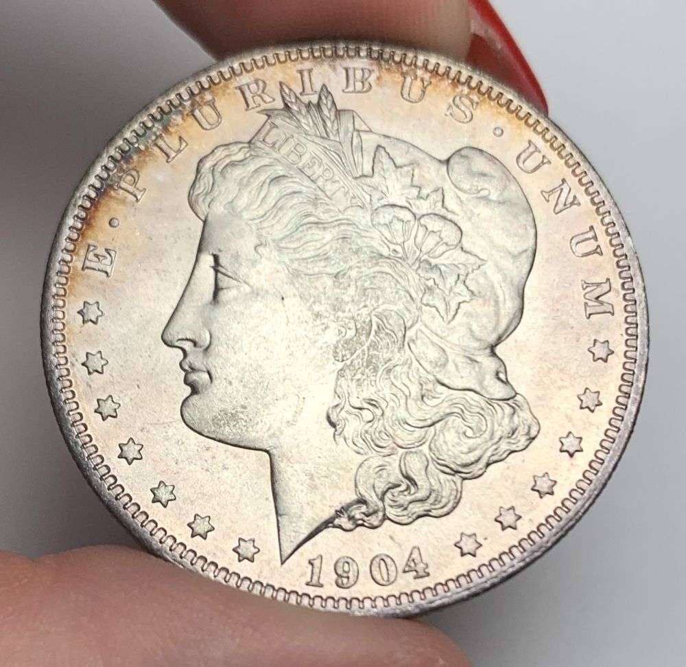Sick Toning 1904-O Morgan Silver Dollar MS64+: A very special consignment. Once in a great while, some really, really nice silver dollars will hit the market. These coins come from a old, old-timer! By order of the consignor, none of these coins a