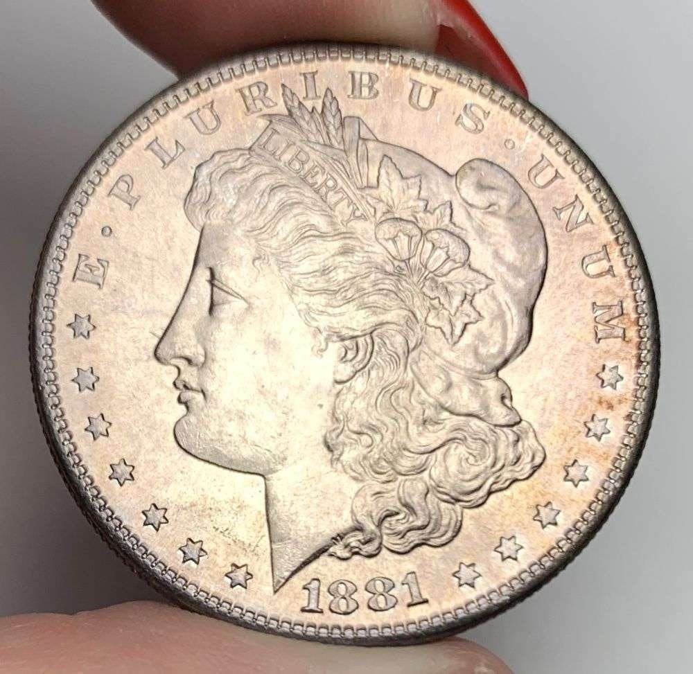 Sick Toning 1881-S Morgan Silver Dollar MS64+: A very special consignment. Once in a great while, some really, really nice silver dollars will hit the market. These coins come from a old, old-timer! By order of the consignor, none of these coins a
