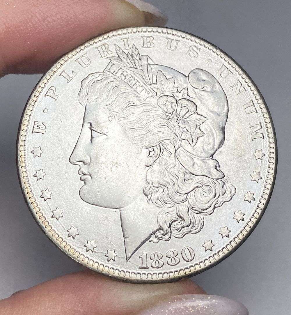 Last Minute! 1880-O Morgan Silver Dollar MS63: A very special consignment. Once in a great while, some really, really nice silver dollars will hit the market. These coins come from a old, old-timer! By order of the consignor, none of these coins a