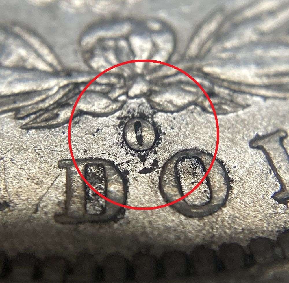 1882-O/S Morgan Silver Dollar AU55: This is the story about two coin dealers, a partnership. One,the largest bullion dealer north of San Francisco, and the other, the largest rare coin dealer north of San Francisco. Together, their shop