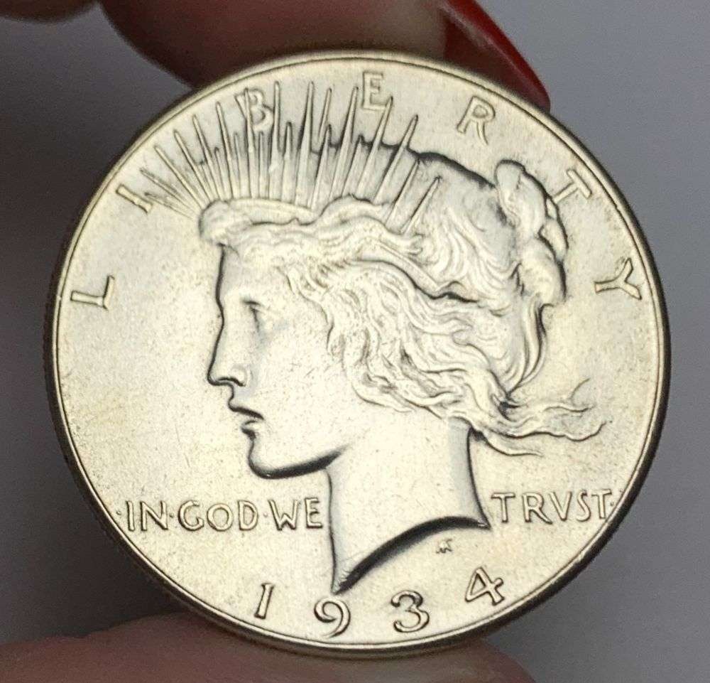 1934 Peace Silver Dollar MS64 Details: This is the story about two coin dealers, a partnership. One,the largest bullion dealer north of San Francisco, and the other, the largest rare coin dealer north of San Francisco. Together, their shop