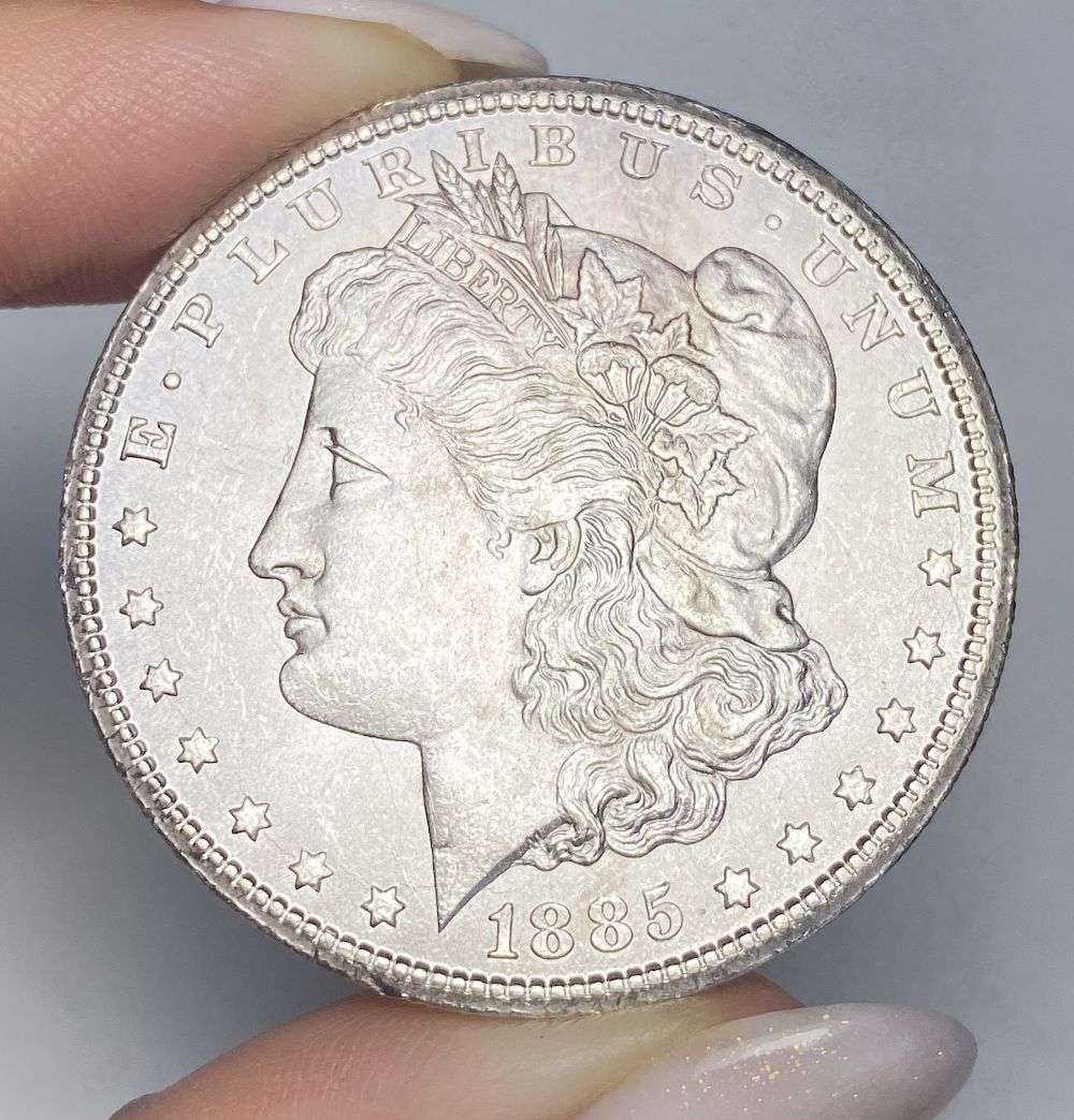 1885-CC Morgan Silver Dollar MS64: This is the story about two coin dealers, a partnership. One,the largest bullion dealer north of San Francisco, and the other, the largest rare coin dealer north of San Francisco. Together, their shop