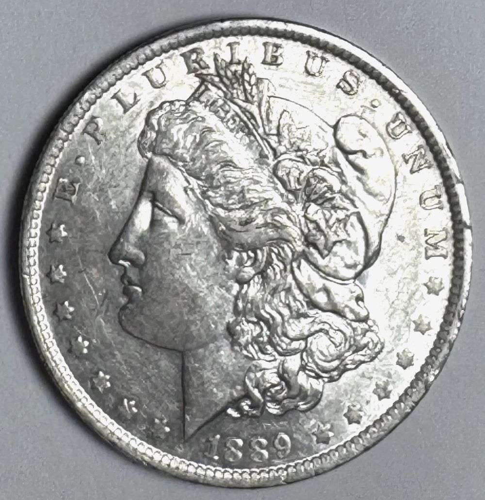 1889-O Morgan Silver Dollar MS62 Details: This is the story about two coin dealers, a partnership. One,the largest bullion dealer north of San Francisco, and the other, the largest rare coin dealer north of San Francisco. Together, their shop