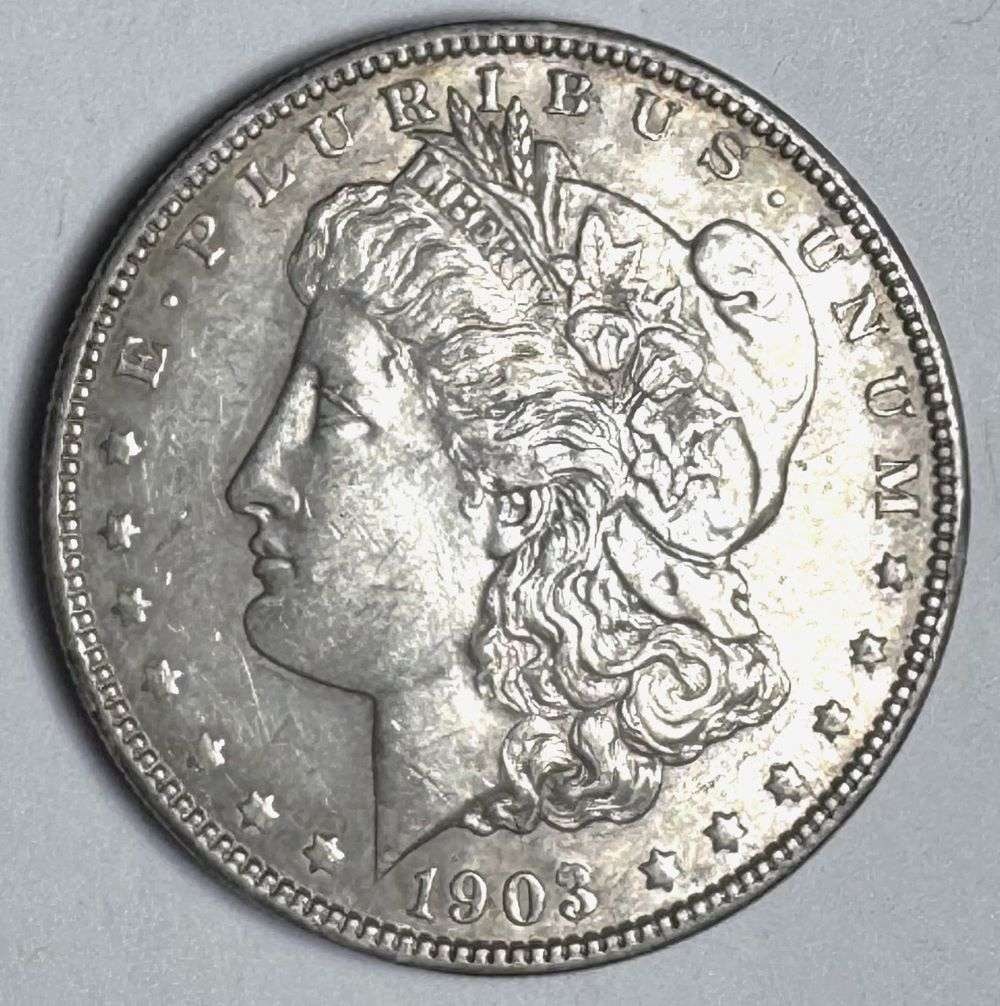 1903 Morgan Silver Dollar MS63 Details: This is the story about two coin dealers, a partnership. One,the largest bullion dealer north of San Francisco, and the other, the largest rare coin dealer north of San Francisco. Together, their shop
