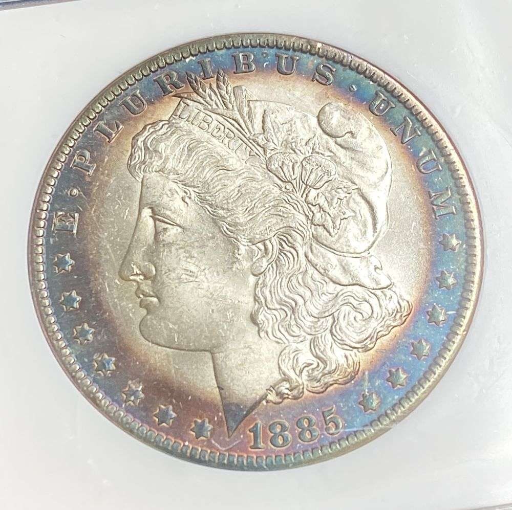 Toned 1885-O Morgan Silver Dollar MS66: IMPORTANT NOTE: We do not agree with the grade provided with this "off-brand" grading company. Winner shall receive the exact coin shown here. (RR)