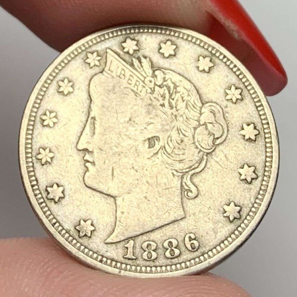 1886 Liberty "V" Nickel VF: This is the story about two coin dealers, a partnership. One, the largest bullion dealer north of San Francisco, and the other, the largest rare coin dealer north of San Francisco. Together, their sho