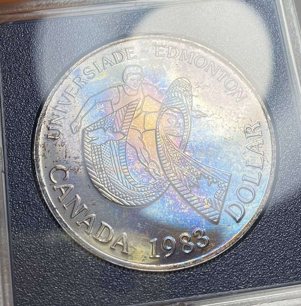 Toned 1983 Canda Silver Dollar (1 of 3)