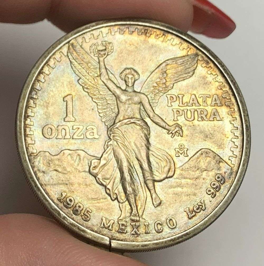 Rare Toned 1985 Mexican Libertad 1 Onza 1 ozt .999 Silver With Bezel: Winner shall receive the exact coin shown here. (MR/UR)