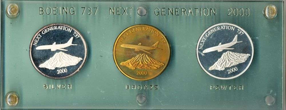 2000 Boeing 737 Next Generation Silver-Bronze-Pewter Proof Set (3-coins) 5.1 ozt: An interesting piece of Boeing and aviation history, this 2000 commemorative three-medal set celebrates the Boeing 737 Next Generation family. The set features three matching medals in silver, bronze,
